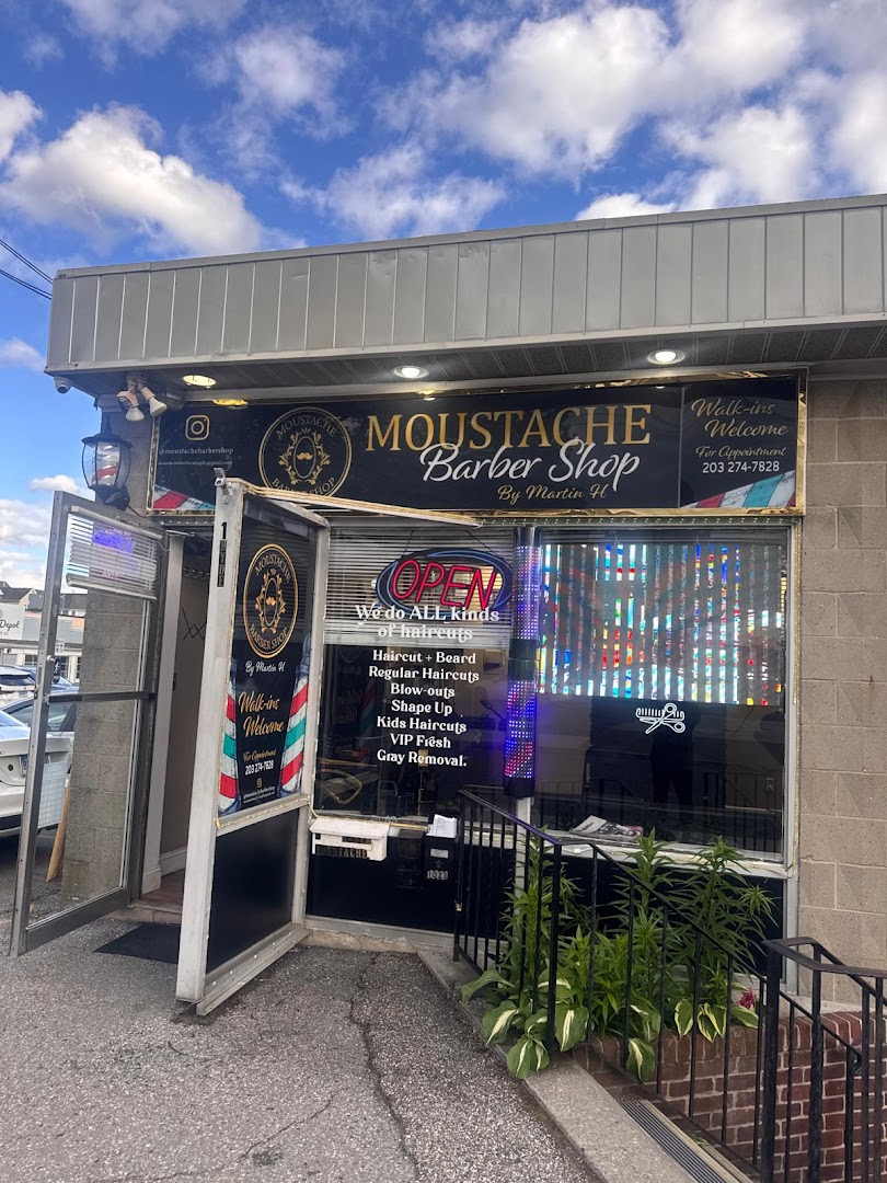 Haircut and beard work at Moustache Barbershop